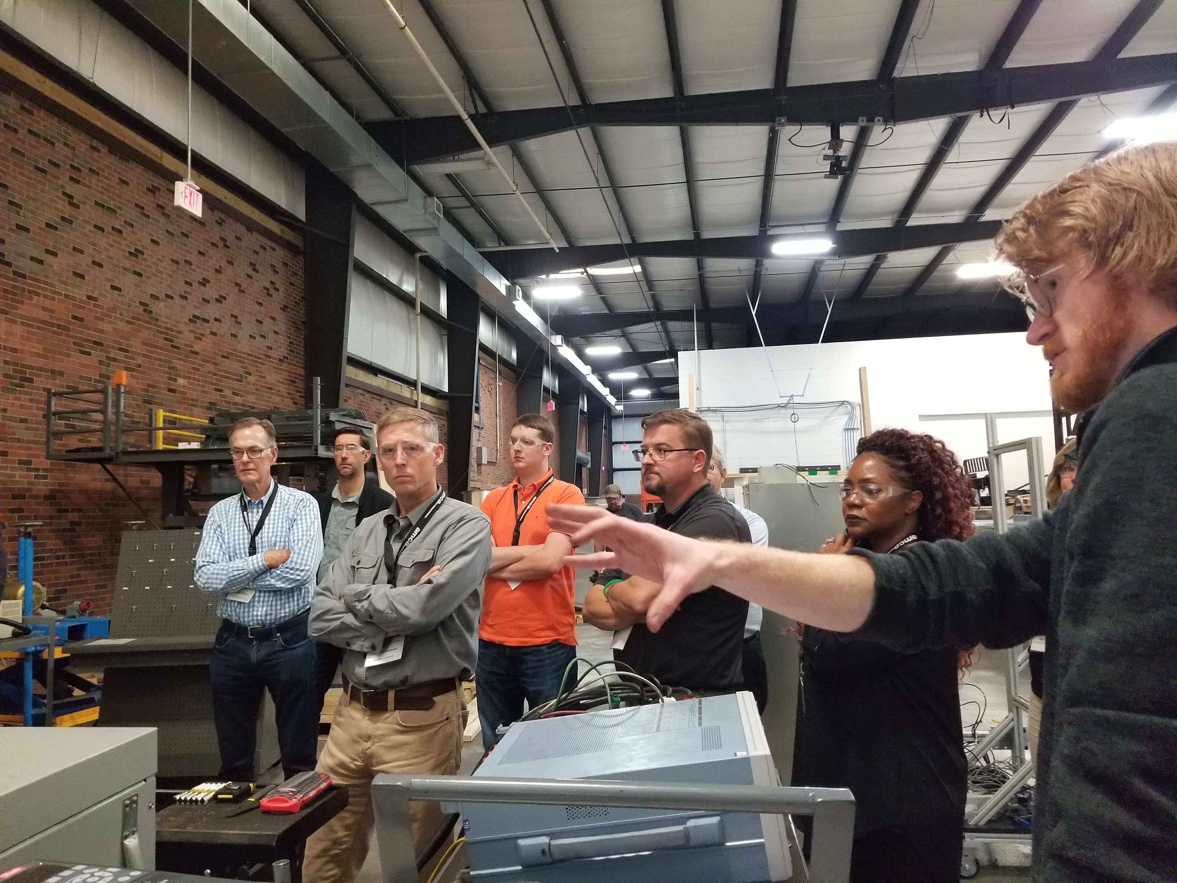 AMCA Laboratory Engineer David Nowak (right) explains how AMCA performs motor-calibration tests.